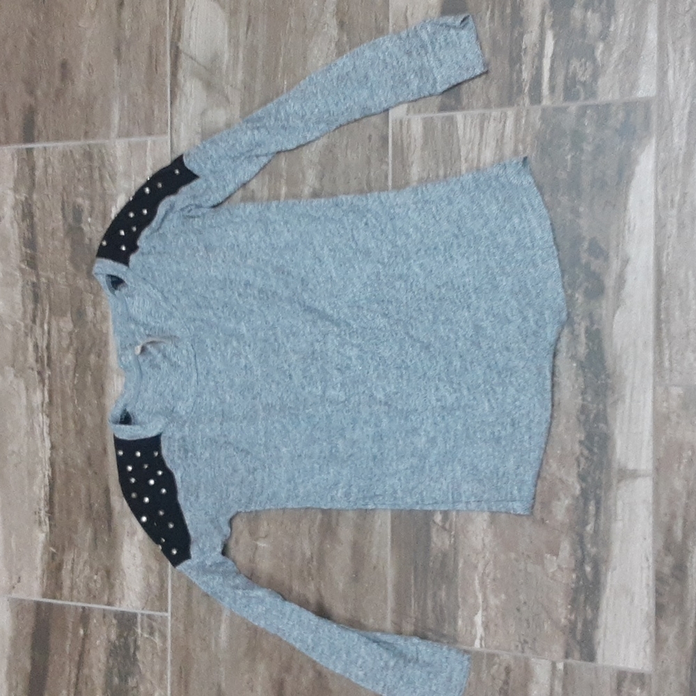 Junior size medium Jolie long sleeved top with studded shoulders